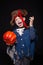 Adorable young boy dressed in a pirate outfit, playing trick or treat for Halloween