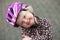 Adorable young girl in a pink safety helmet