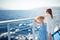 Adorable young girls enjoying ferry ride staring at the deep blue sea. Children having fun on summer family vacation in Greece