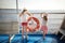 Adorable young girls enjoying ferry ride staring at the sea on sunset. Children having fun on summer family vacation in Greece