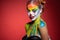 Adorable young woman with a aqua makeup clown