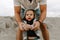 Adorably Perfect Young Father and Baby Toddler Son Family Having Fun Time at the Sandy Beach During Sunset Outside By the Ocean Wa