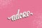Adore. Hand drawn Lettering on pink background.