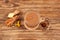 Adrak chai, Popular Indian drink. Ginger tea with milk and spicy spices on old wooden table, top view