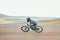 Adrenaline, blur and athlete riding a motorcycle in nature training for a race, marathon or competition. Sports, motion