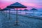 Adriatic coast sunset with beach umbrellas