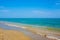 Adriatic Sea coast view. Seashore of Italy, summer sandy beach with clouds on horizon.