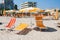 Adriatic Sea coast view. Seashore of Italy, summer umbrellas on sandy beach with clouds on horizon.