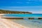Adriatic sea shore in Croatia, Pag island, pine woods and long sand beach with pier