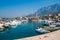 Adriatic sea shore with small leisure boats inside the harbor of Makarska City