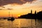 Adriatic sea with some boats sailing and the view of the croatian houses of Rovinj, Croatia, and the bell tower of the Church of