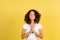 Adult afro american woman on yellow copy space background