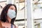 Adult Asian women wearing surgical face mask and walk inside public area. New normal and social distance lifestyle concept.