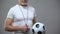 Adult athletic soccer coach playing with ball, active lifestyle, sports activity