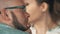 Adult bald man in glasses caress beard, talking with wife