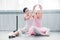 adult ballerina exercising with cute little child