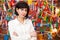 Adult brunette woman against the background of many flags