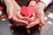 Adult and child hands holding heart shape, health care, donate and family insurance concept