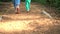 Adult and children feet barefoot walk on sensory path sawdust surface