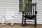Adult and childs rocking chairs on wood porch