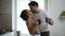 Adult couple kissing together in the kitchen Spbd. Handsome man kissing woman. male flirting