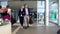 Adult couple leaving airport, people arriving on vacation, family holidays