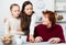 Adult daughter controlling signing of documents by grandmother