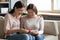 Adult daughter greeting mother with birthday at home