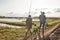 Adult father and teenager son going to fishing together.