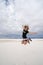 Adult female jumps in the sand dunes of White Sands National Monument