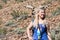 Adult female looks off into the distance while hiking in the Sierra Nevada mountains