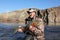 Adult fisherman holding steelhead trout