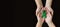 Adult hands holds green ribbon on black background. World lymphoma awareness day. September 15. Liver, Gallbladders bile