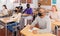 Adult hispanic man in protective mask during lesson