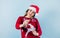 Adult hispanic woman holding christmas sparkling lights for mexican posada in christmas on yelllow background in Mexico Latin Amer