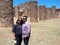 Adult Latino couple with letes and hats explore the La Quemada archaeological site in Zacatecas Mexico on a vacation or weekend wa