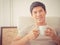 Adult male enjoying morning coffee on a sofa