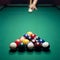 Adult male playing pool, snooker or billiard