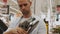 Adult man chooses a new angle grinder in a tool shop
