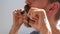 Adult man cutting his own beard and mustache with scissors and comb. Caucasian red bearded male trimming hair on face at home 4K