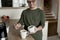 Adult man with down syndrome preparing morning coffe
