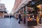 An adult man looks at a shop window on an old pedestrian street in Venice