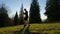 Adult man practicing martial arts and shadow boxing in a park. Health and fitness concept.