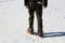 Adult man with snowshoes in winter