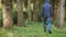 Adult man walking the dog in the woods. concept nature health