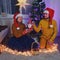 An adult man and a woman play a homemade puppet show at the Chri Year