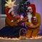 An adult man and a woman play a homemade puppet show at the Chri Year