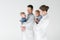 adult pediatricians holding little babies