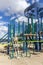 Adult skeleton sitting on playground equipment at an empty closed park on a nice day