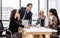 Adult smart diverse Caucasian businesspeople wearing formal suit, taking break, smiling, working, meeting, discussing and relax